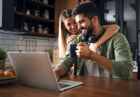 Couple w/Laptop in Kitchen
